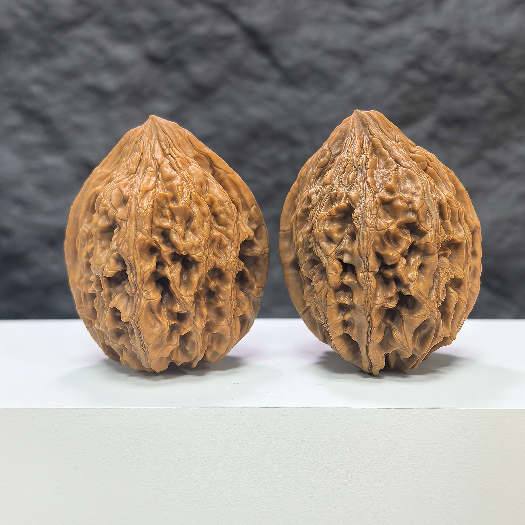 Pair of Classic Scholar Wenwan Walnuts from Wenwan Art, hand-matched, 42mm x 43mm, featuring smooth, polished 大沽石 stones.