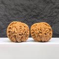 Close-up of a Butterfly Millstone Wenwan Walnut by Wenwan Art, showing detailed butterfly pattern on a 38mm x 37mm walnut piece.