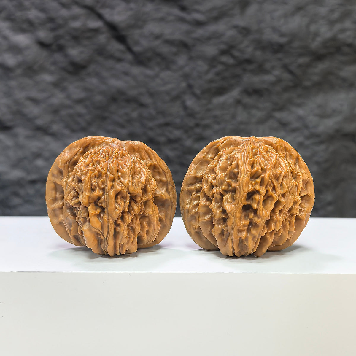 Pair of Sizuolou Classic Wenwan Walnuts by Wenwan Art, 42mm x 38mm, featuring smooth, polished walnut carvings.