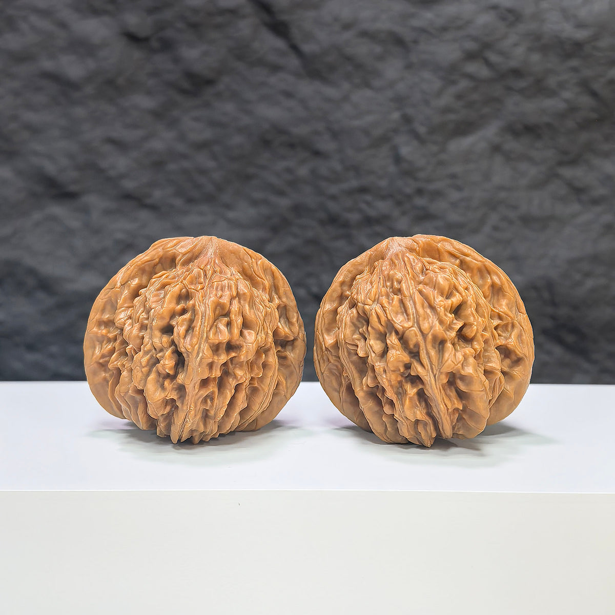 Wenwan Art Sizuolou Classic Wenwan Walnut pair, 41mm x 42mm, showcasing smooth, polished walnut carvings with intricate details.