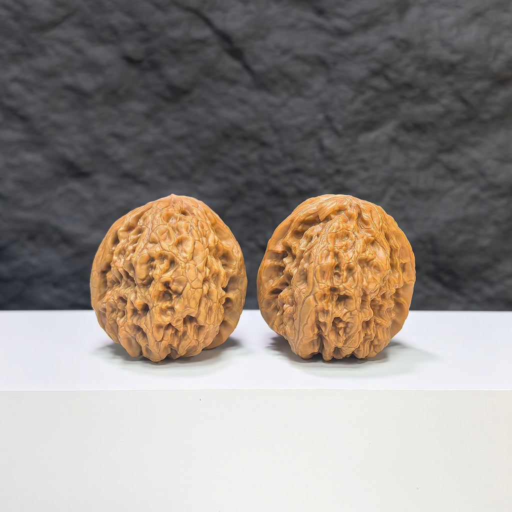 Pair of Wenwan Art Rolling Donkey Walnuts, 40mm classic Wenwan walnuts with detailed carvings, traditional Chinese collectible art pieces.