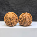 Pair of Nanjiangstone Wenwan walnuts by Wenwan Art, 37mm each, featuring natural stone texture and detailed carving.