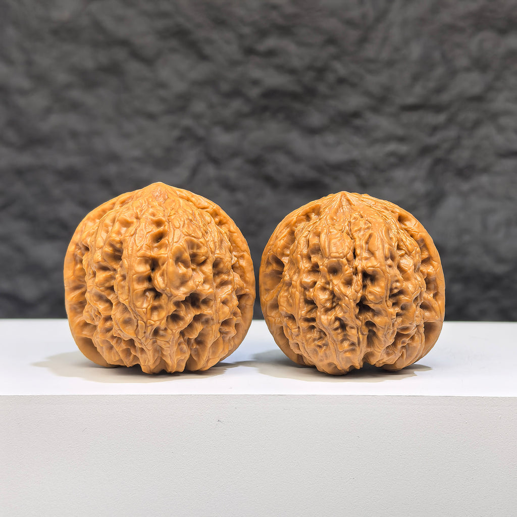 Miniature Wenwan Walnut pair from Wenwan Art, 34mm x 33mm, featuring intricate Yuhua stone details and natural walnut shape.