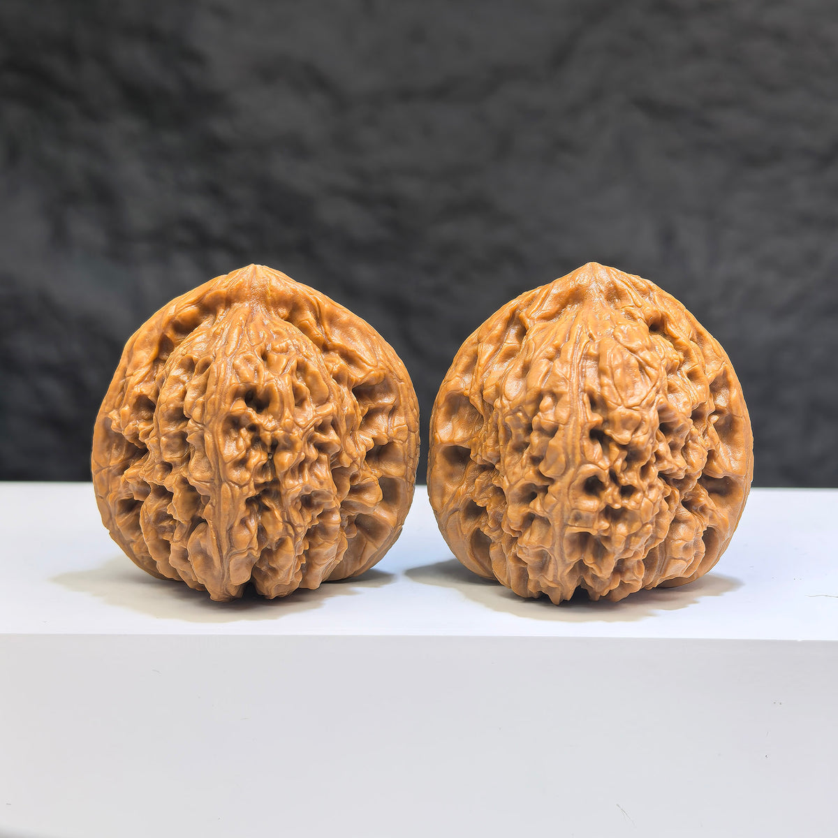 Pair of Nanjiangstone Wenwan walnuts by Wenwan Art, 38mm size, showcasing smooth, polished natural stone walnuts.