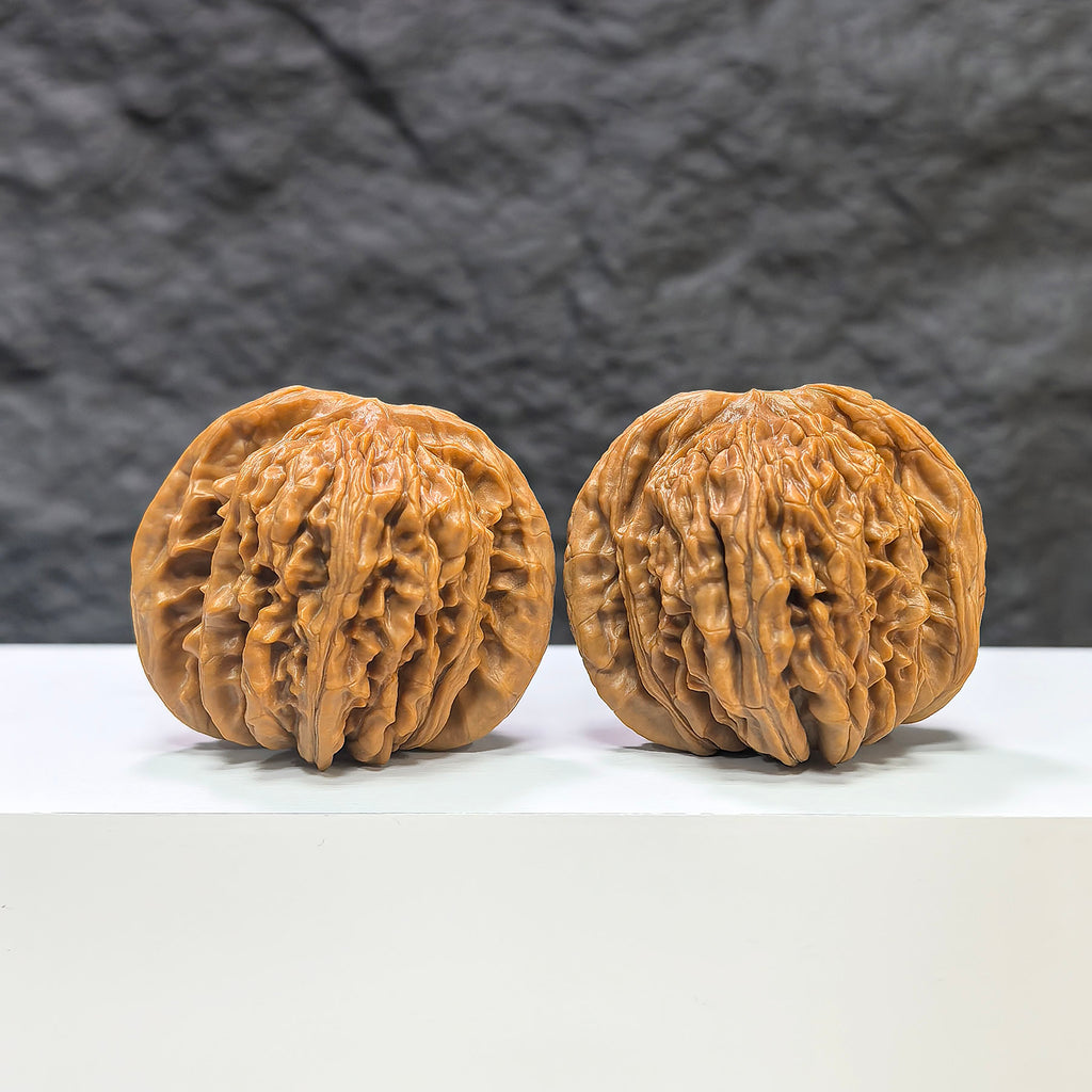 Pair of Sizuolou Classic Wenwan Walnuts from Wenwan Art, 43mm x 39mm, showcasing detailed carved walnut sculptures.