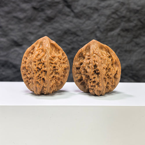 Golden Kylin Wenwan Walnut pair by Wenwan Art, 37mm x 36mm, showcasing detailed natural walnut textures and golden finish.