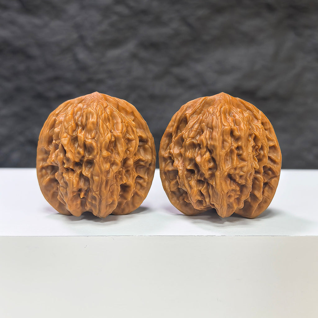 Wuling Mountain Pocket Wenwan Walnut pair from Wenwan Art, miniature Wenwan walnuts measuring 35mm x 32mm, detailed natural carvings.