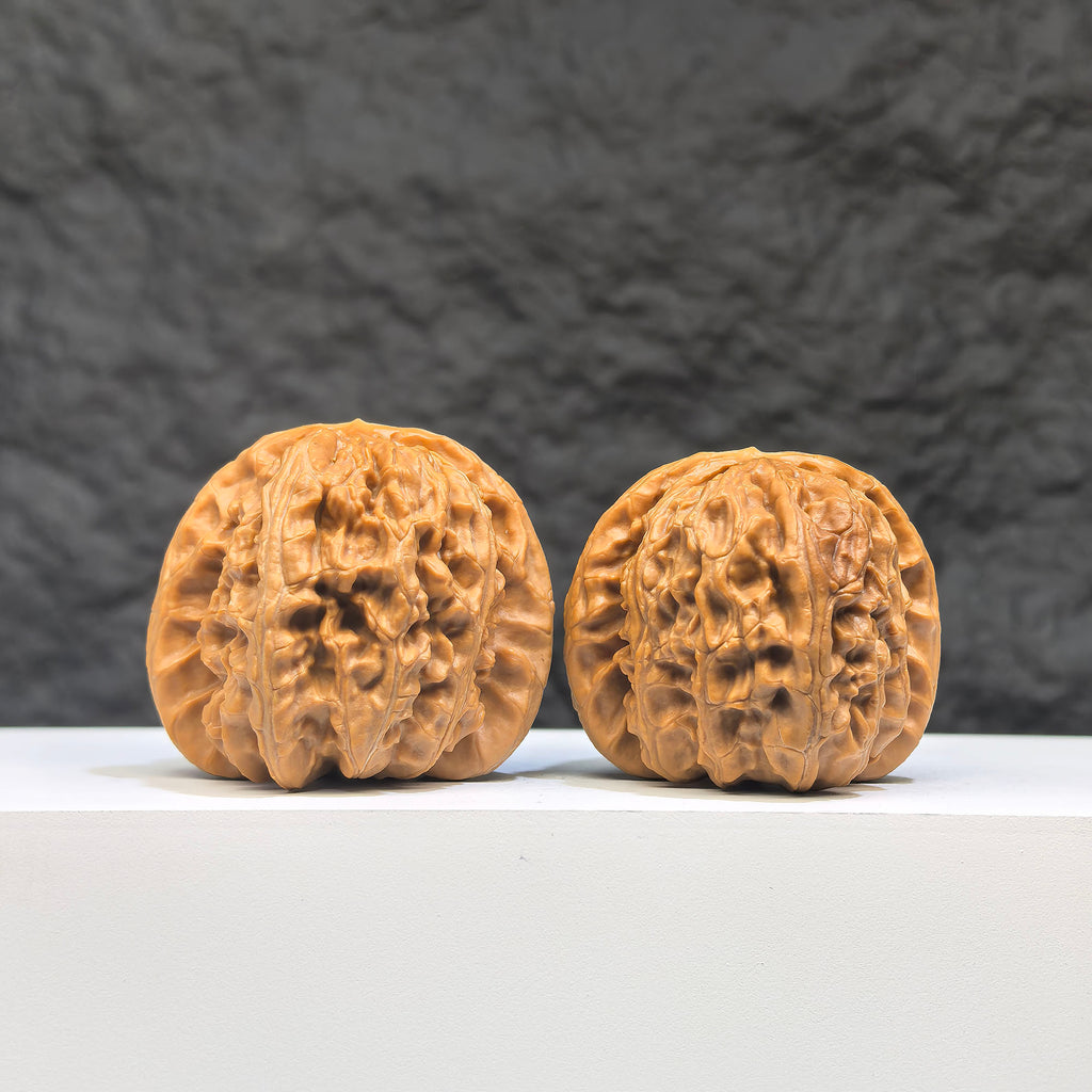Pair of spherical white lion Wenwan walnuts from Wenwan Art, round-profile, 41mm size, with detailed white lion carvings.