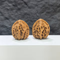 Pair of Tongtian Eight Classic Wenwan Walnuts from Wenwan Art, 33mm, featuring intricate natural wood grain and smooth polished surfaces.