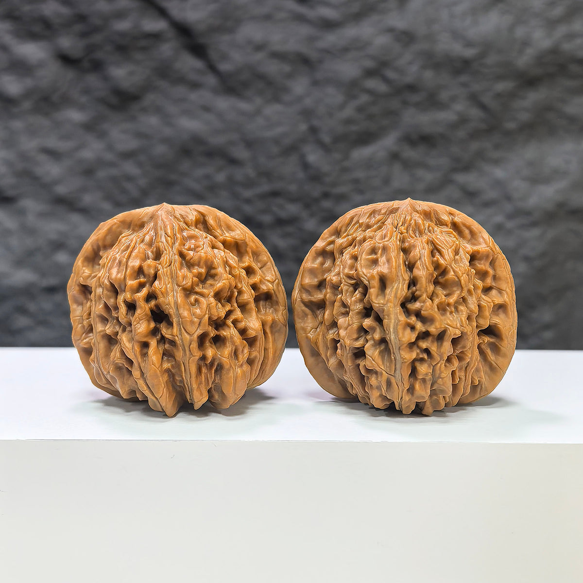 Pair of Sizuolou Classic Wenwan Walnuts from Wenwan Art, detailed natural wood grain, measuring 42mm x 41mm.