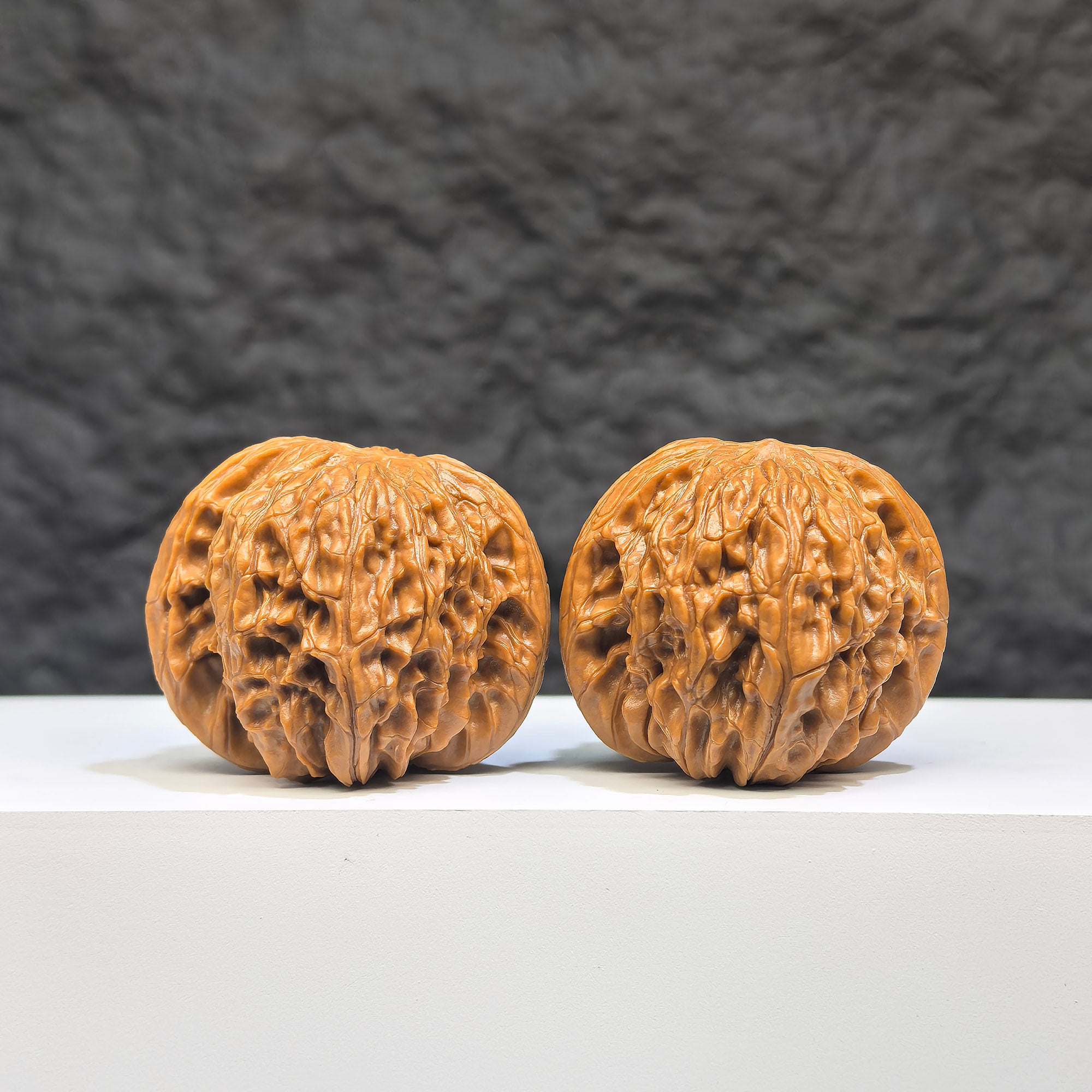 Red Shell Millstone Wenwan Walnut pair by Wenwan Art, 42mm x 38mm, featuring vibrant red shells and intricate carvings.