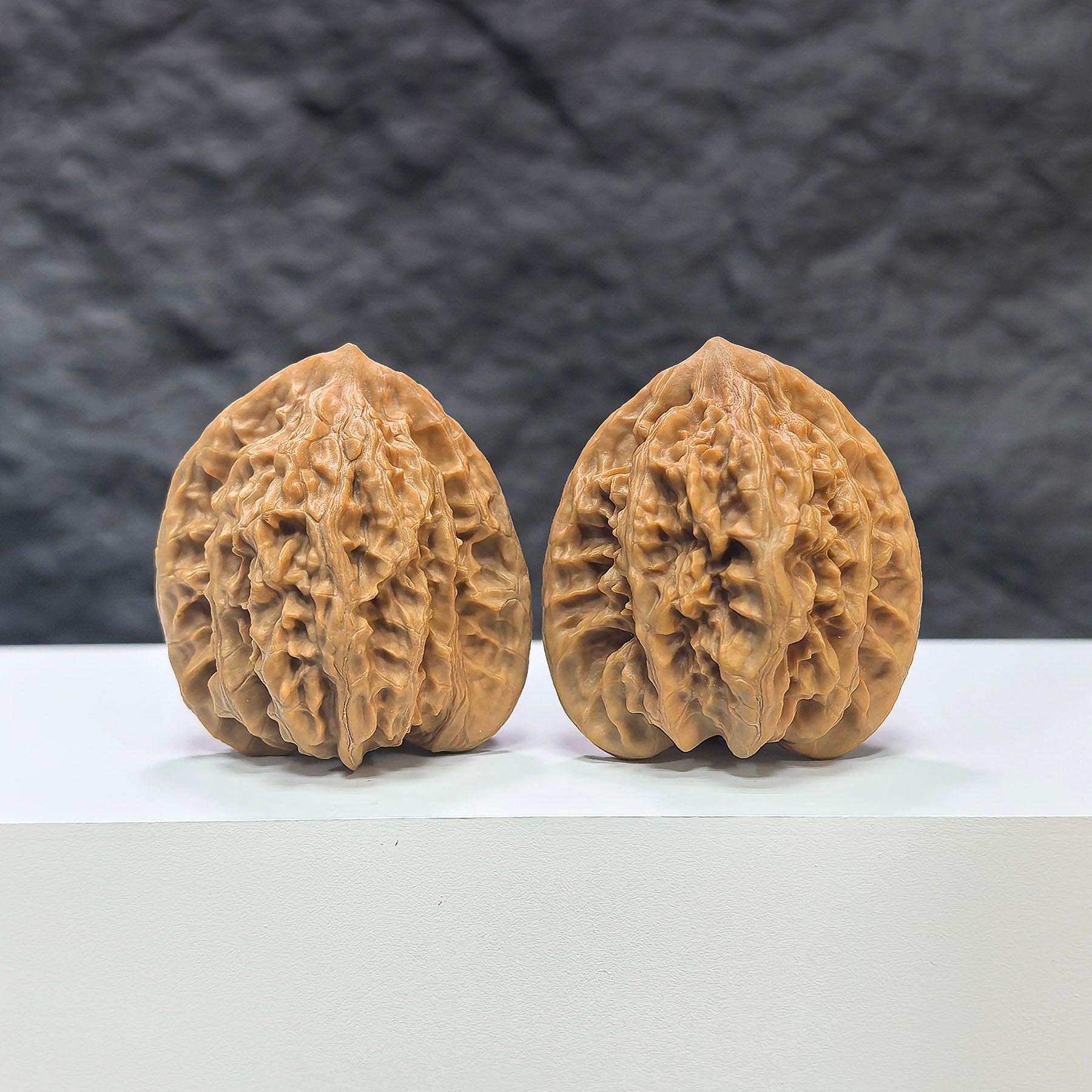 Pair of Xiayunling Classic Wenwan Walnuts from Wenwan Art, 37mm x 35mm, featuring intricate natural wood grain patterns.