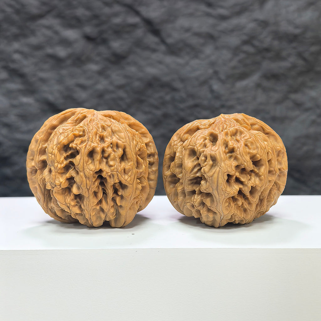 Pair of Classic Scholar Wenwan Walnuts by Wenwan Art, hand-matched with rough texture, 45mm size, showcasing detailed natural walnut surfaces.