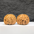 Pair of Wenwan Art "Ruby" classic Wenwan walnuts, 41mm x 37mm, featuring red gemstone-like appearance and detailed craftsmanship.