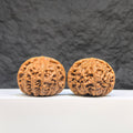 Pair of Palace Lantern Wenwan walnuts from Wenwan Art, featuring detailed carvings and a smooth, polished surface, 41mm by 37mm.
