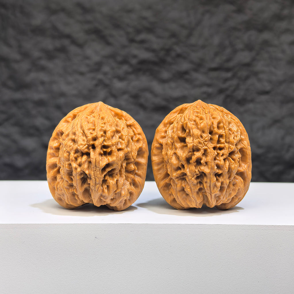 Pair of Wenwan Walnut miniature stones from Wenwan Art, 34mm x 32mm, featuring intricate Yuhua Stone patterns.