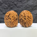 Pair of Beijing Chicken Heart Wenwan walnuts from Wenwan Art, showing detailed, polished walnut surfaces with natural wood grain.
