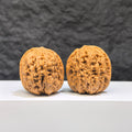 Pair of Wenwan Walnut miniatures, Pocket Yuhua Stone by Wenwan Art, 32mm size, showing detailed natural stone textures and colors.