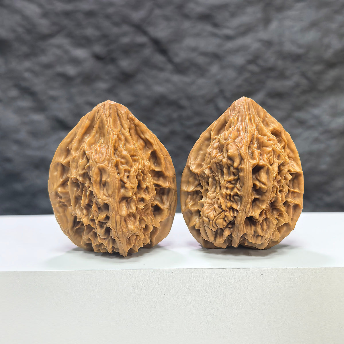 Pair of Beijing Chicken Heart Wenwan walnuts from Wenwan Art, 41mm, showcasing detailed natural walnut textures and rich color.