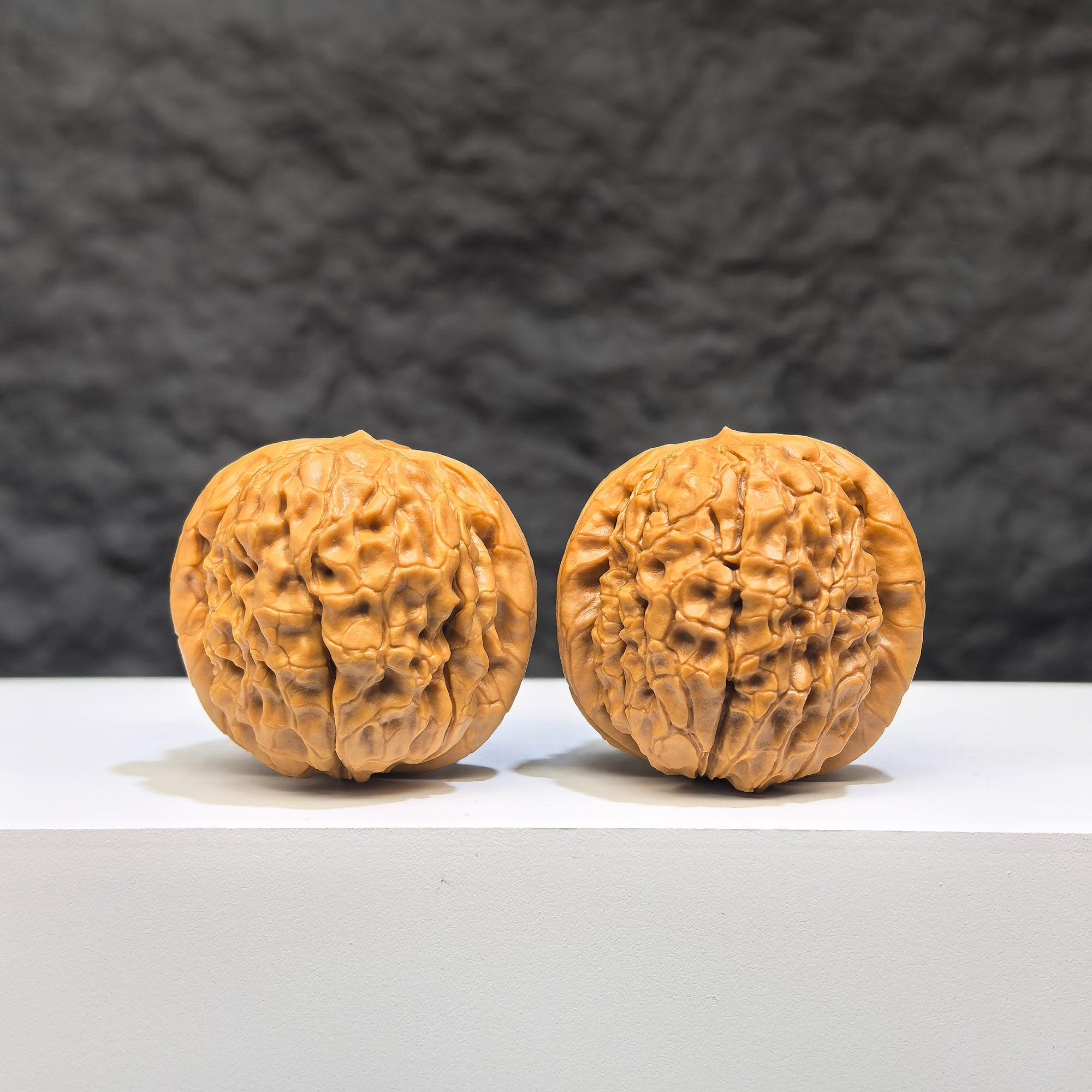 Miniature Wenwan Walnut pair with Oracle Bone Script carvings, 33mm x 31mm, crafted by Wenwan Art, showcasing detailed traditional design.