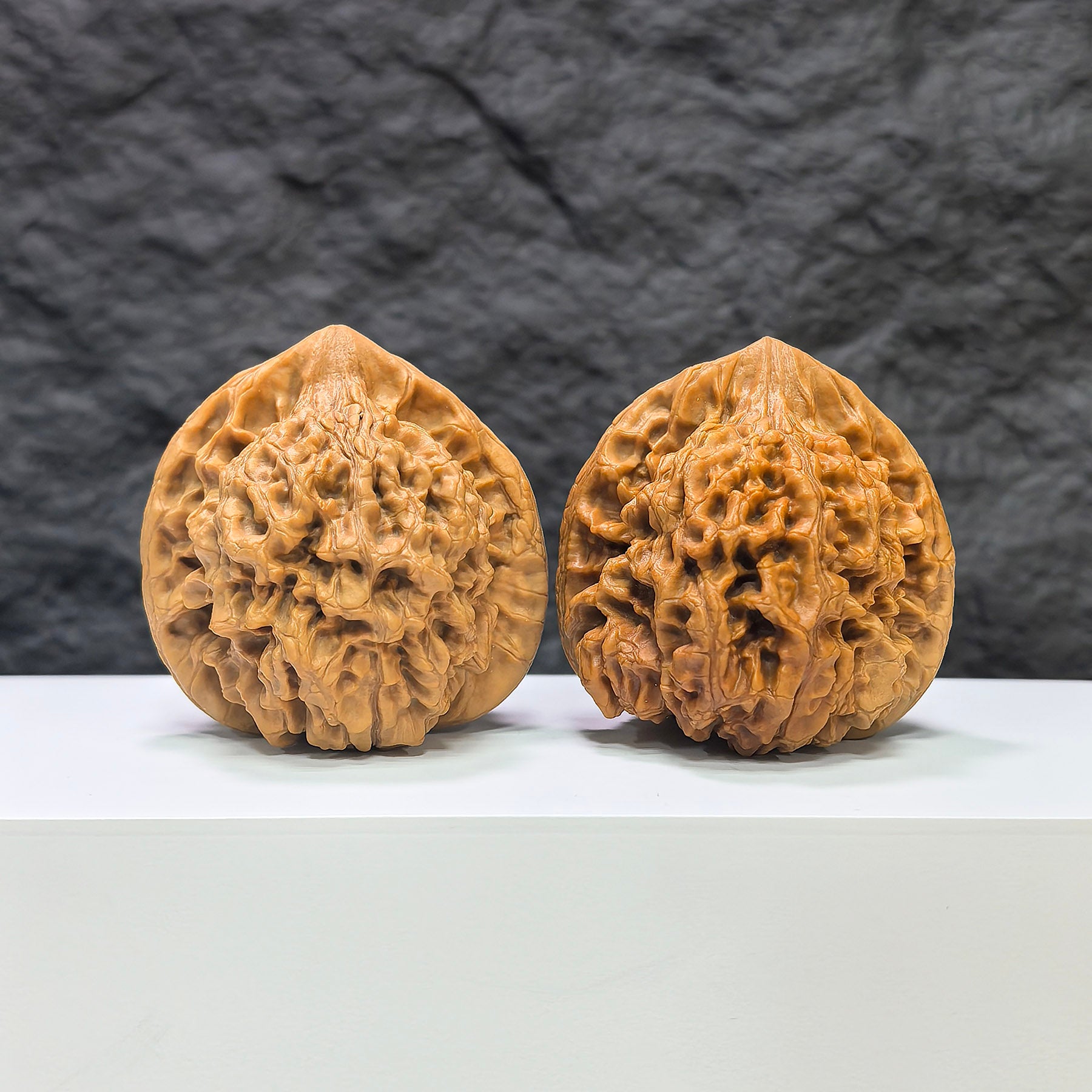 Pair of large Wenwan Art official-style Wenwan walnuts, 48mm x 45mm, showcasing smooth, polished surface with natural walnut pattern.