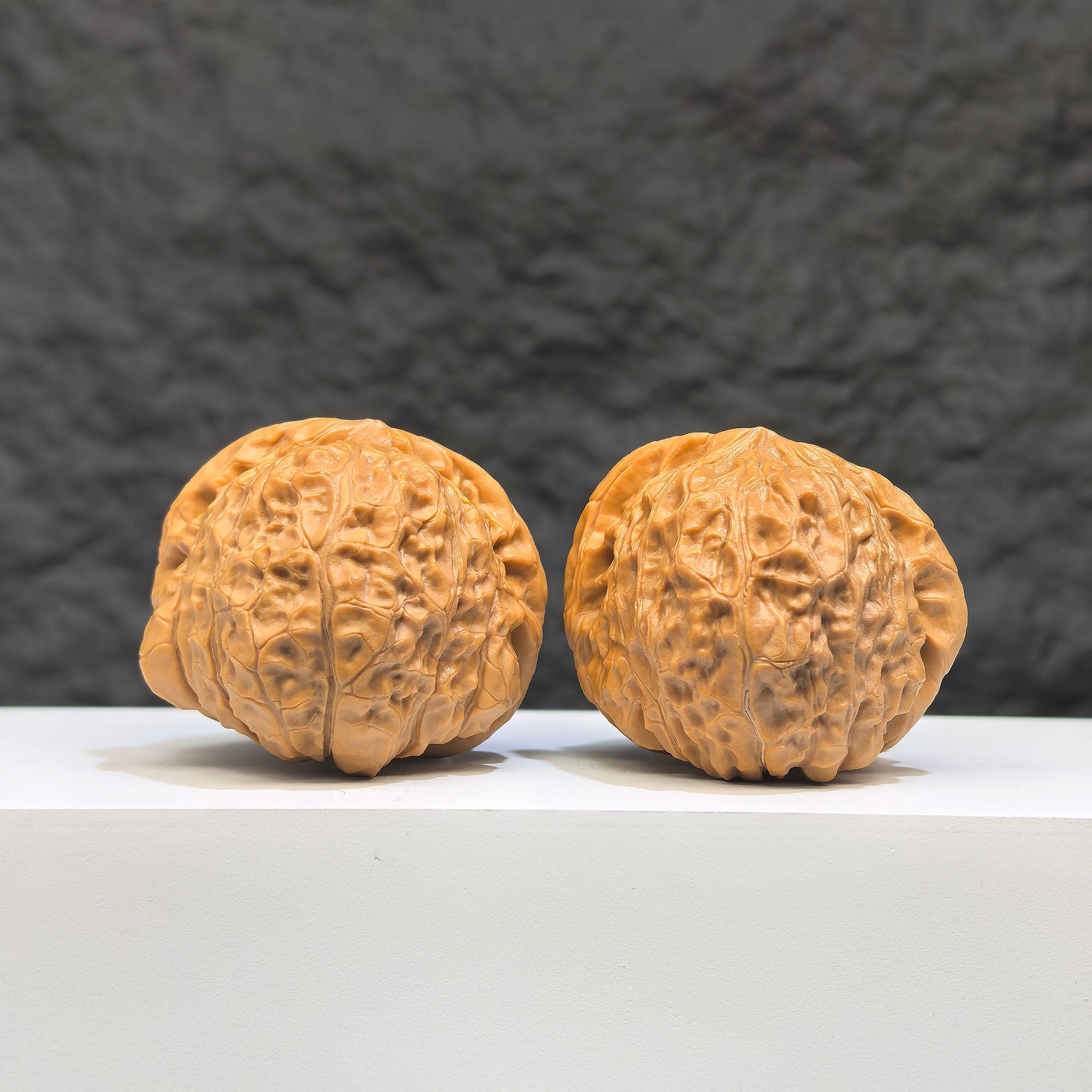 Pair of Pumpkin Pier Wenwan Walnuts by Wenwan Art, 41mm x 44mm, featuring detailed pumpkin-shaped carvings.