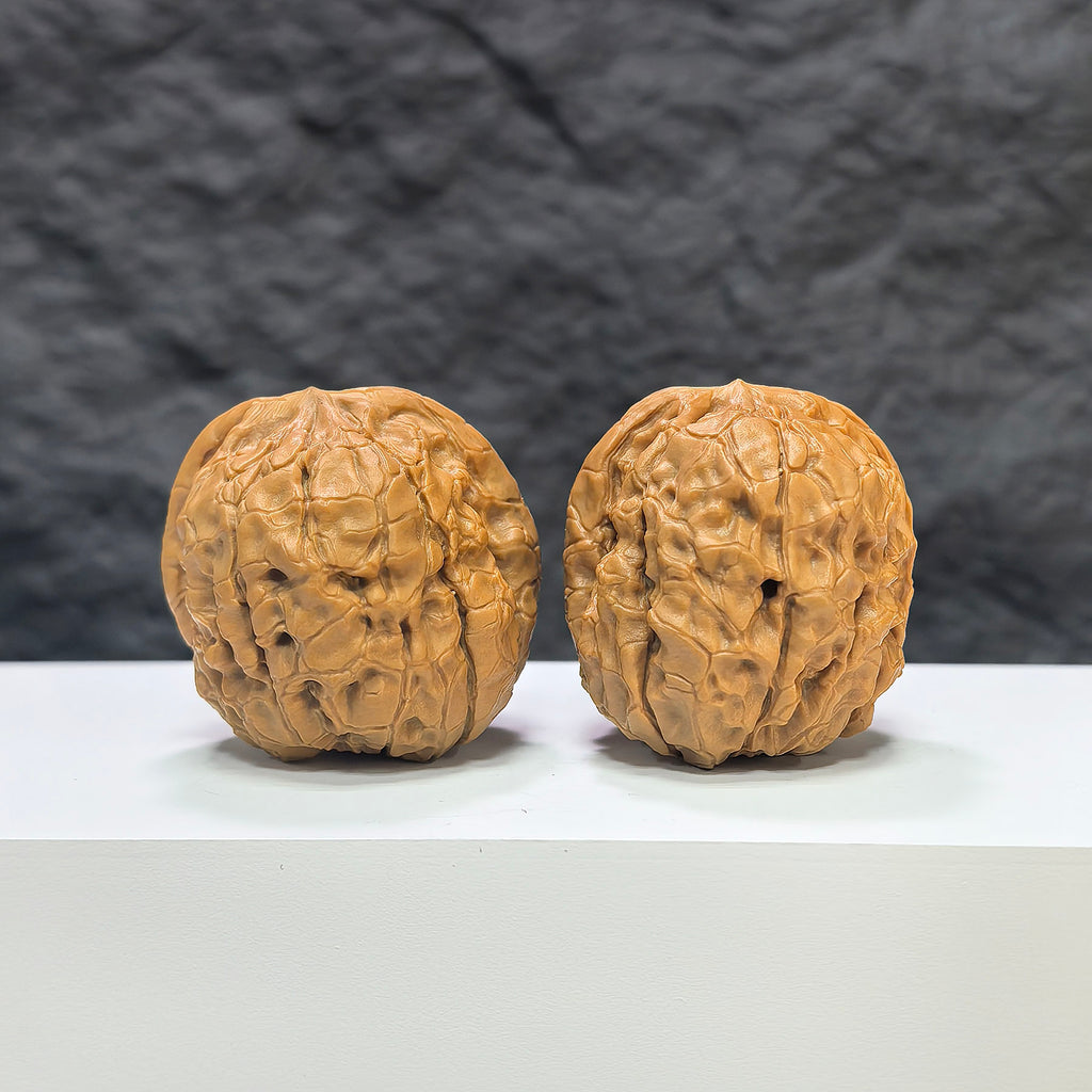 Pair of Classic Scholar Wenwan walnuts by Wenwan Art, hand-matched 39mm diameter, featuring intricate carvings and smooth surfaces.
