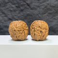 Pair of Classic Scholar Wenwan walnuts by Wenwan Art, hand-matched 39mm diameter, featuring intricate carvings and smooth surfaces.