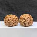 Pair of spherical white lion Wenwan walnuts from Wenwan Art, 38mm round-profile white walnut carvings with intricate lion designs.