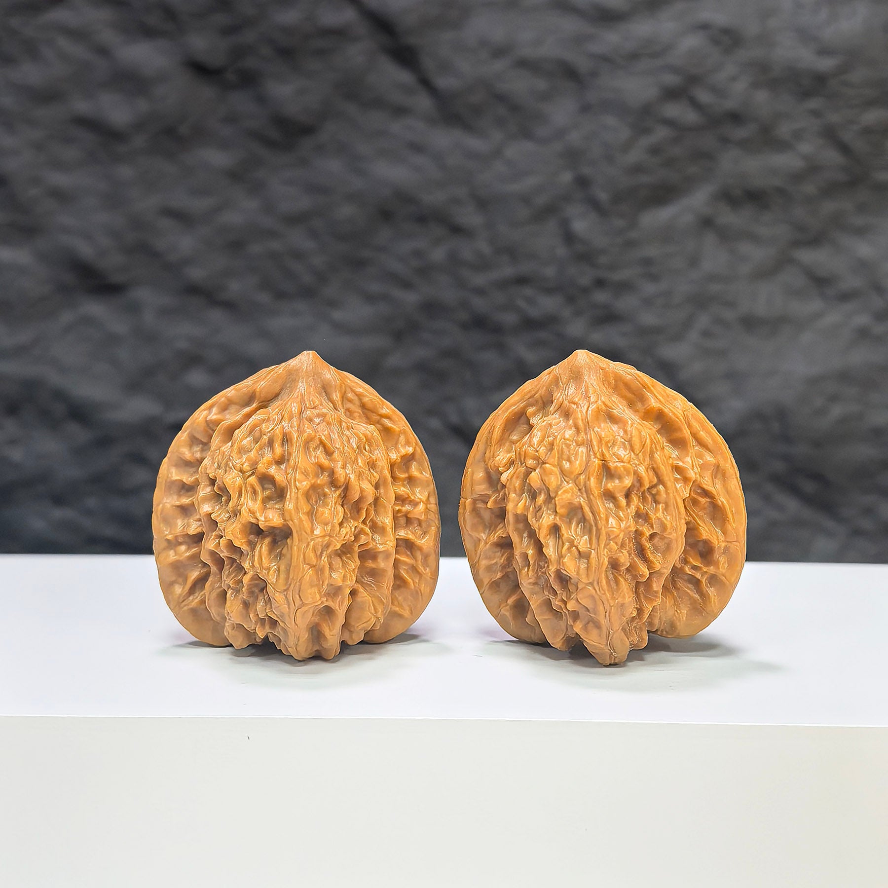 Pair of Xiayunling Classic Wenwan Walnuts by Wenwan Art, 36mm size, showing detailed textured walnut surfaces and natural color.