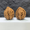 Pair of Dazhan Stone Wenwan Walnuts by Wenwan Art, 41mm x 42mm, showcasing detailed craftsmanship and natural stone textures.