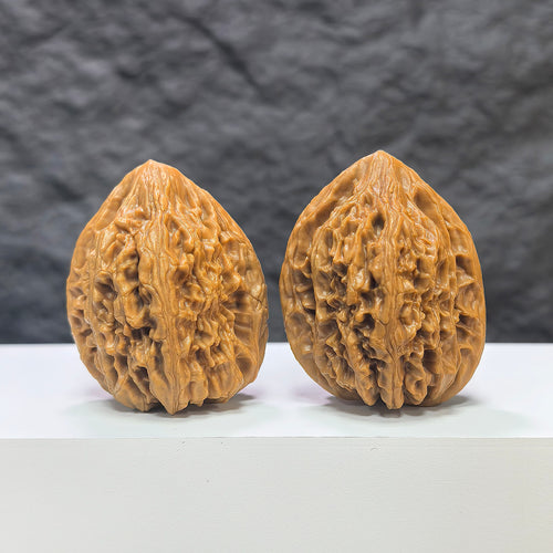 Pair of Beijing Chicken Heart Wenwan walnuts from Wenwan Art, 39mm, featuring detailed natural walnut textures and smooth surfaces.