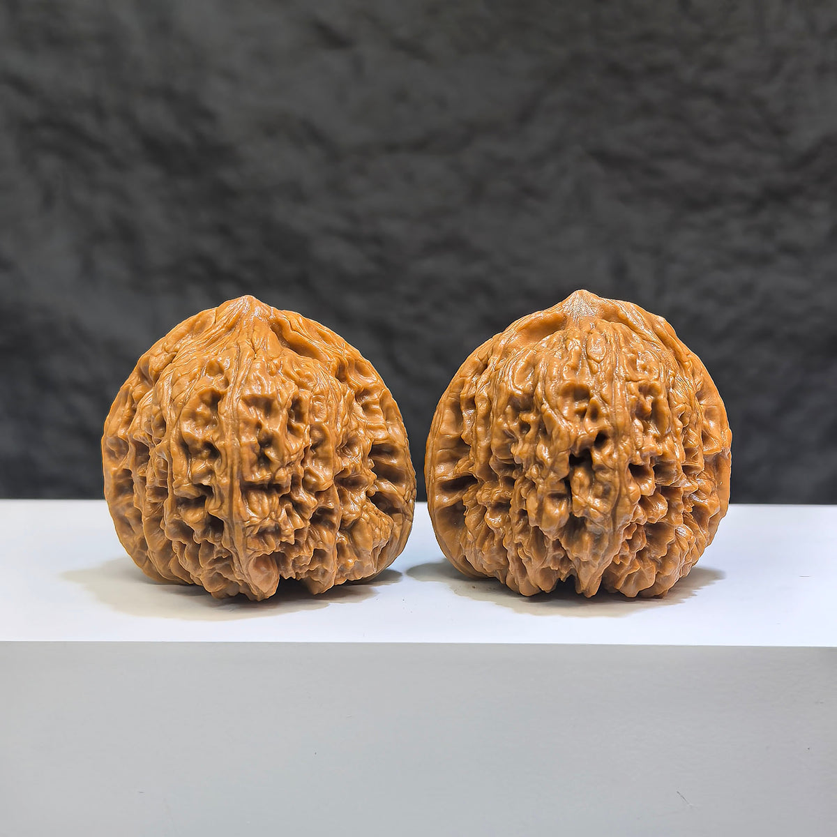 Pair of Classic Scholar Wenwan Walnuts by Wenwan Art, 42mm, hand-matched, triangular concave bottom South Xinjiang stone.