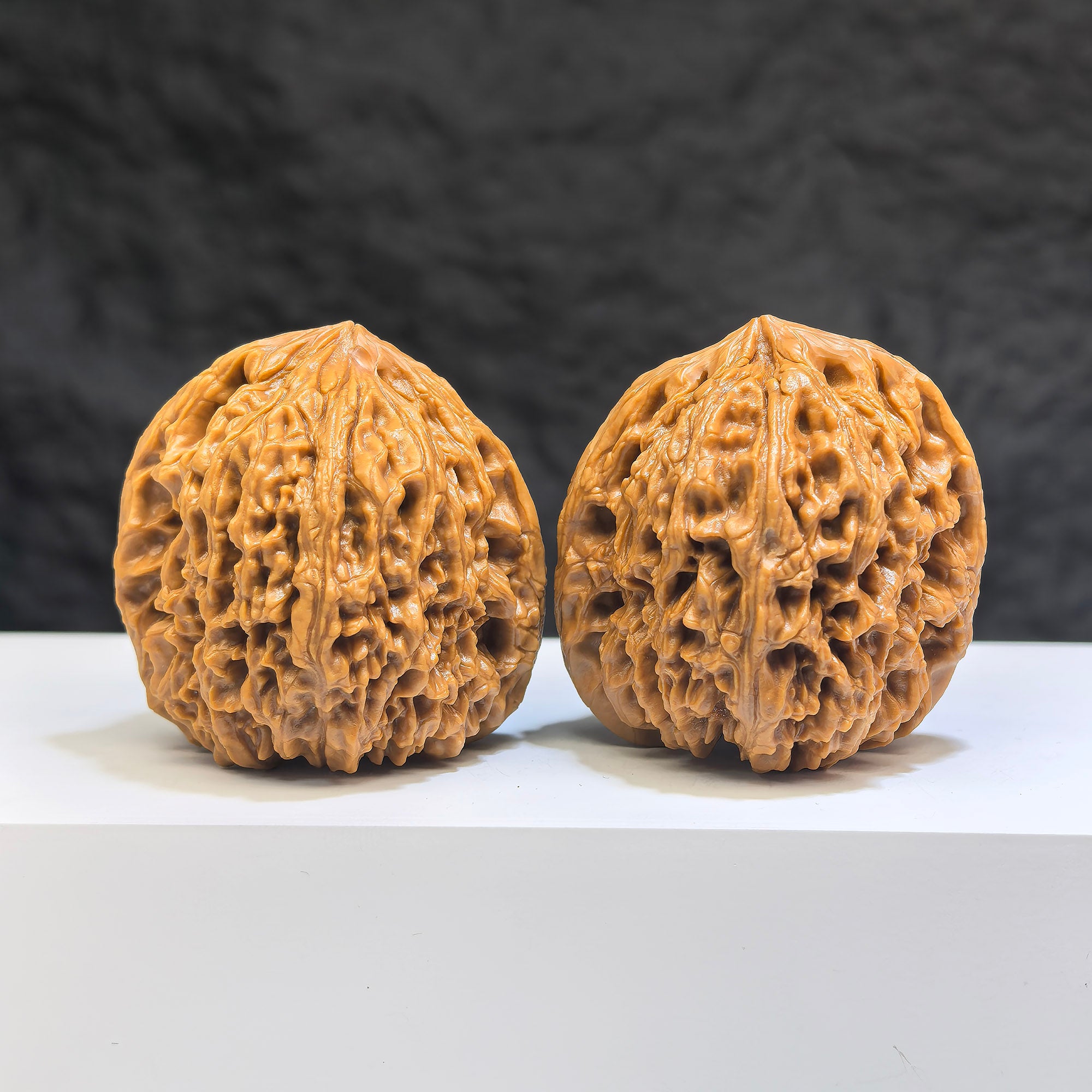 Pair of Nanjiangstone Wenwan walnuts from Wenwan Art, 41mm x 40mm, featuring smooth, polished stone surfaces with natural patterns.
