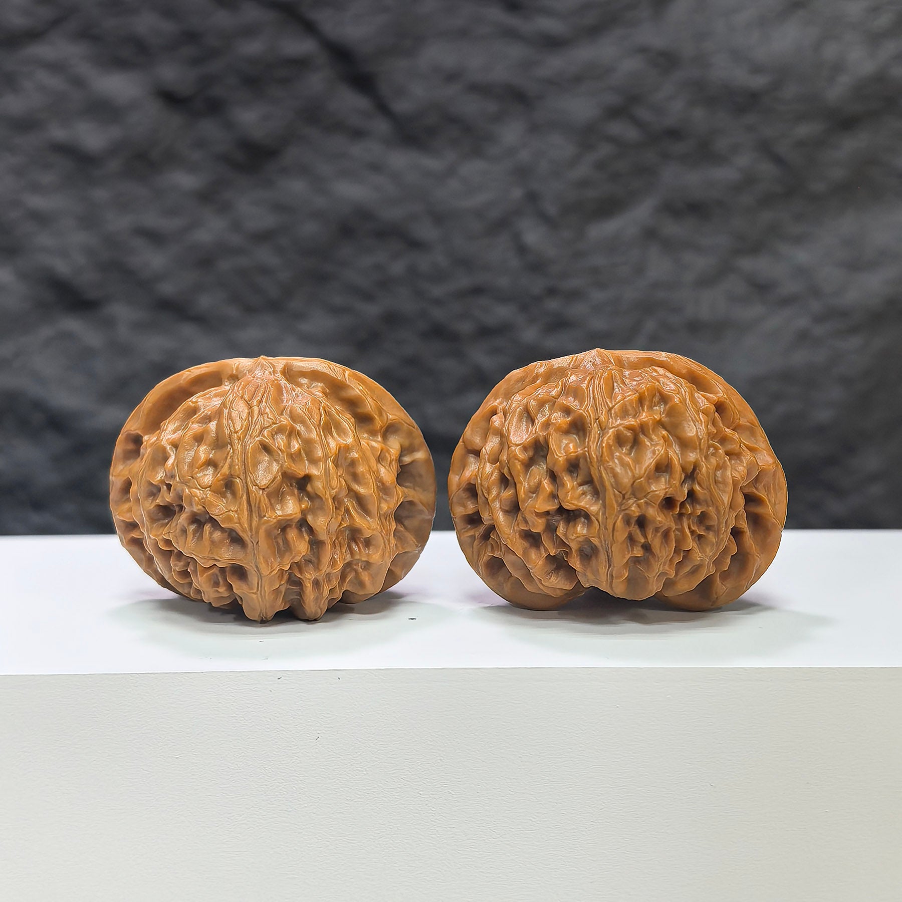 Pair of Classic Scholar Wenwan Walnuts by Wenwan Art, hand-matched with 43mm and 38mm sizes, shown in natural close-up.