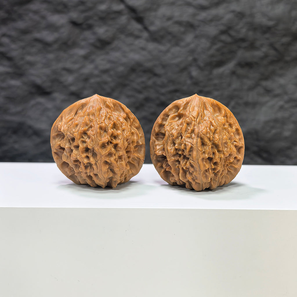 Golden Kylin Classic Wenwan Walnut pair by Wenwan Art, showing two polished walnut carvings with intricate golden Kylin designs.