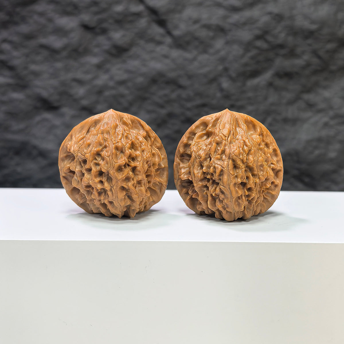 Golden Kylin Classic Wenwan Walnut pair by Wenwan Art, showing two polished walnut carvings with intricate golden Kylin designs.