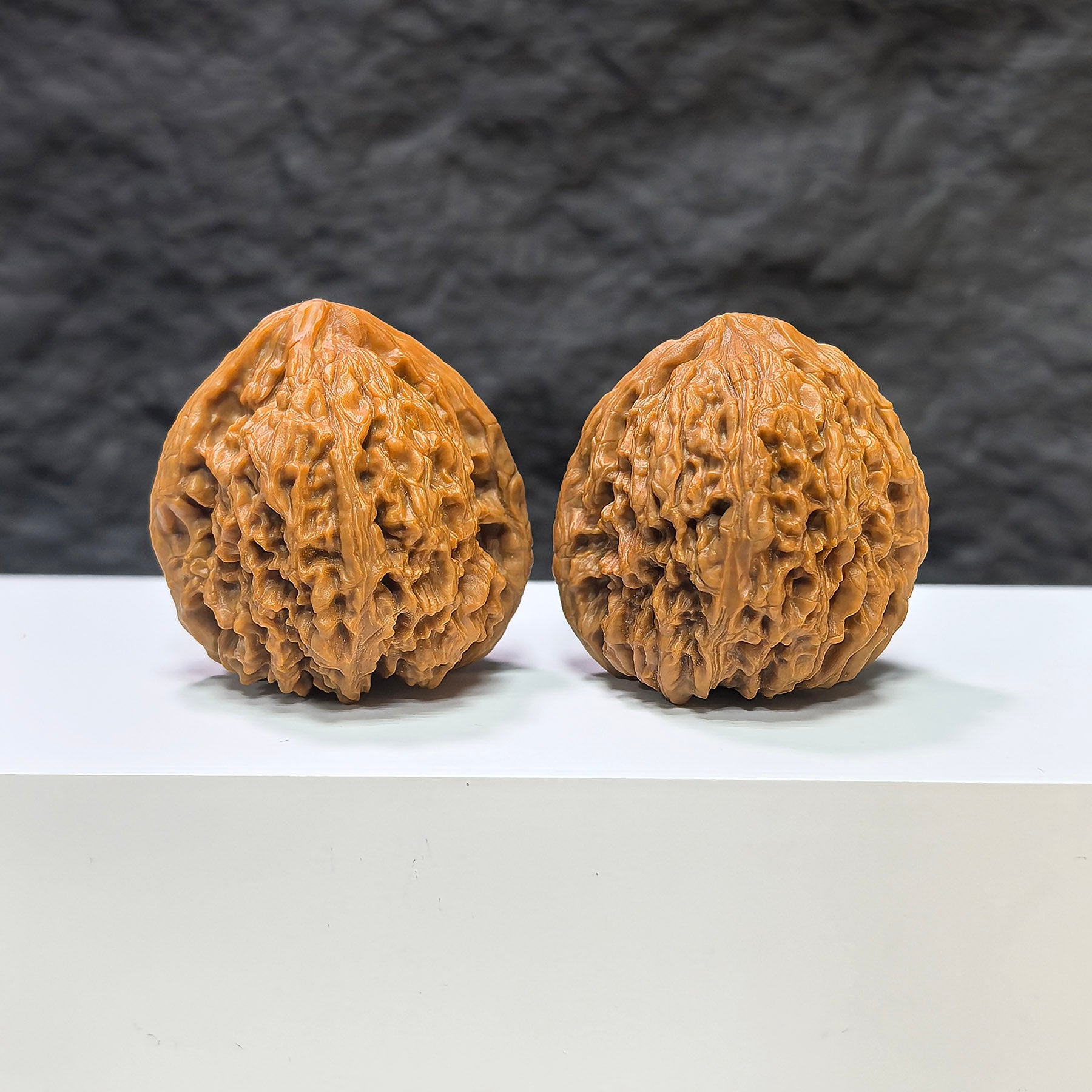 Wenwan Art selected grade Tri-Angular Nanjiangstone walnut, 3.9cm x 3.8cm, showcasing smooth surface and unique natural patterns.