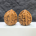 Pair of Classic Scholar Wenwan walnuts by Wenwan Art, hand-matched Beijing Chicken Heart style, 42mm x 40mm, detailed wood grain.