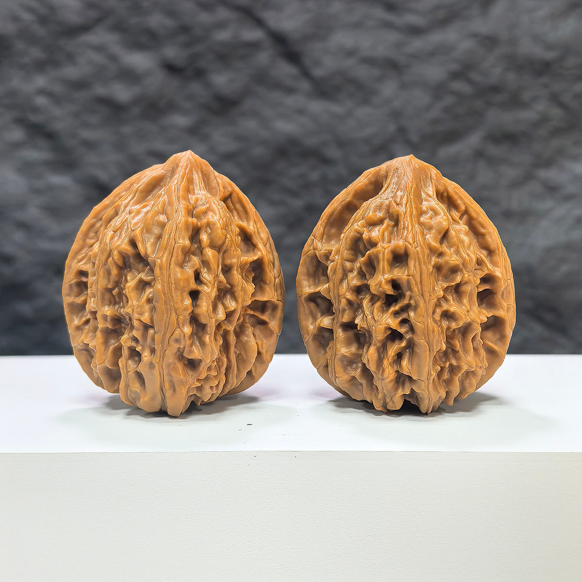 Pair of Classic Scholar Wenwan walnuts by Wenwan Art, hand-matched Beijing Chicken Heart style, 42mm x 40mm, detailed wood grain.