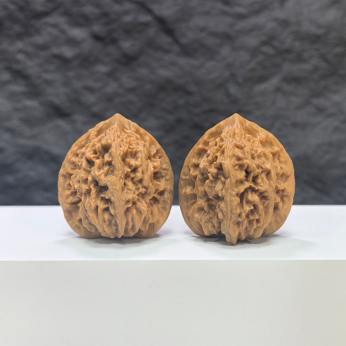Pair of Peach Heart Xiayunling Wenwan walnuts from Wenwan Art, 38mm x 36mm, featuring natural wood grain and smooth polished surface.