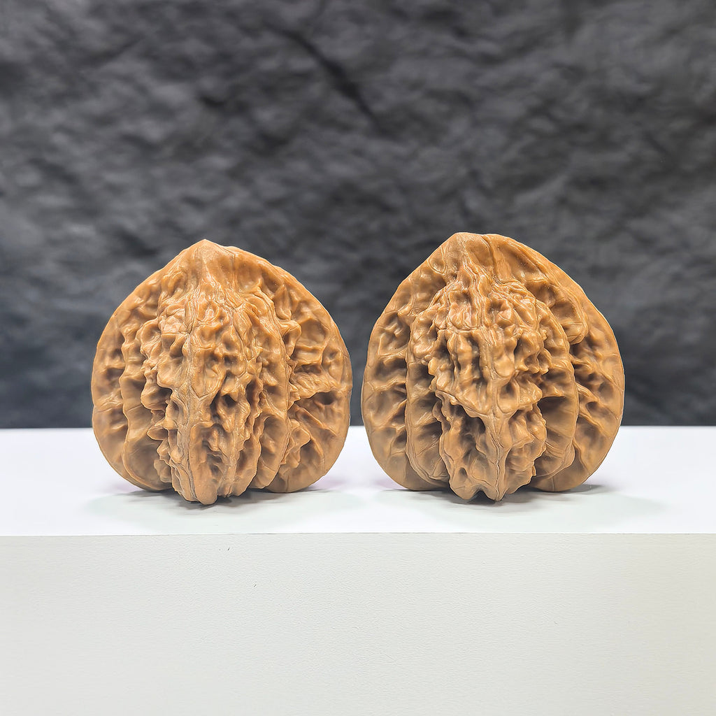 Pair of Xiayunling Wenwan walnuts from Wenwan Art, 43mm x 41mm, featuring smooth, polished walnut shells with natural wood grain.