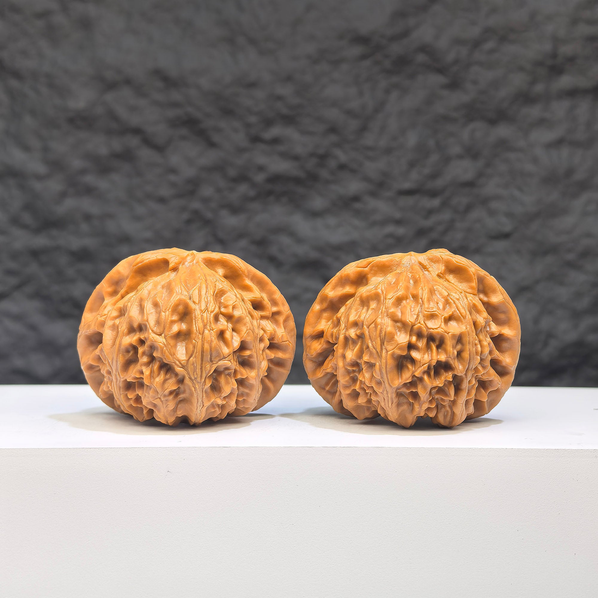 Pair of Palace Lantern Wenwan walnuts by Wenwan Art, 44mm x 38mm, showcasing intricate patterns and natural walnut texture.