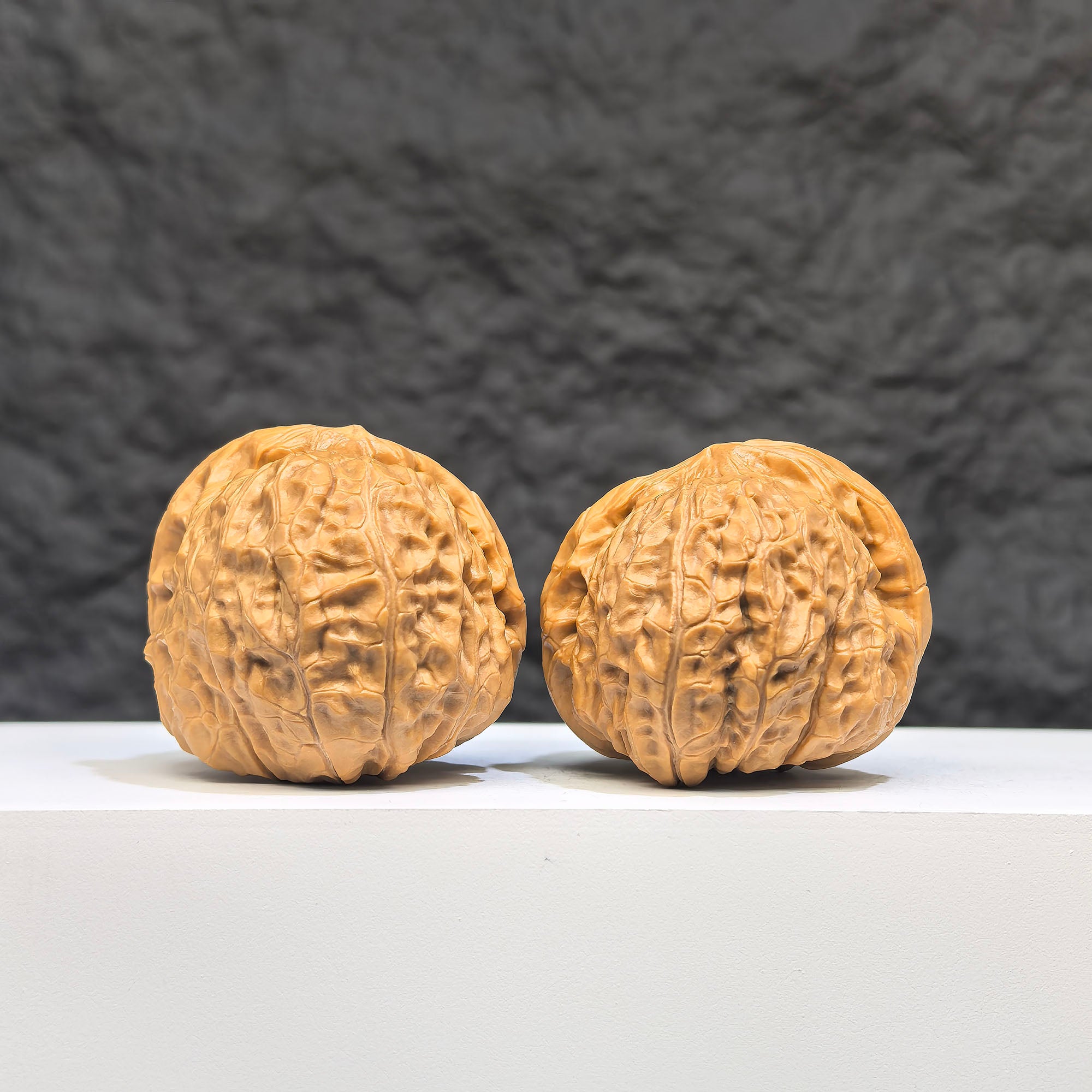 Pair of small pumpkin-shaped Wenwan walnuts by Wenwan Art, measuring 39mm x 42mm, showcasing detailed miniature walnut carvings.