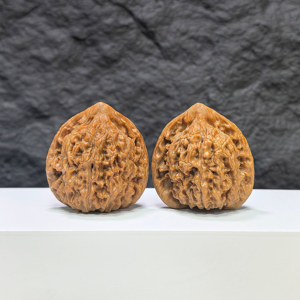 Pair of Kylin Texture Wenwan Walnuts by Wenwan Art, 40mm x 37mm, showcasing detailed natural walnut surface and classic design.