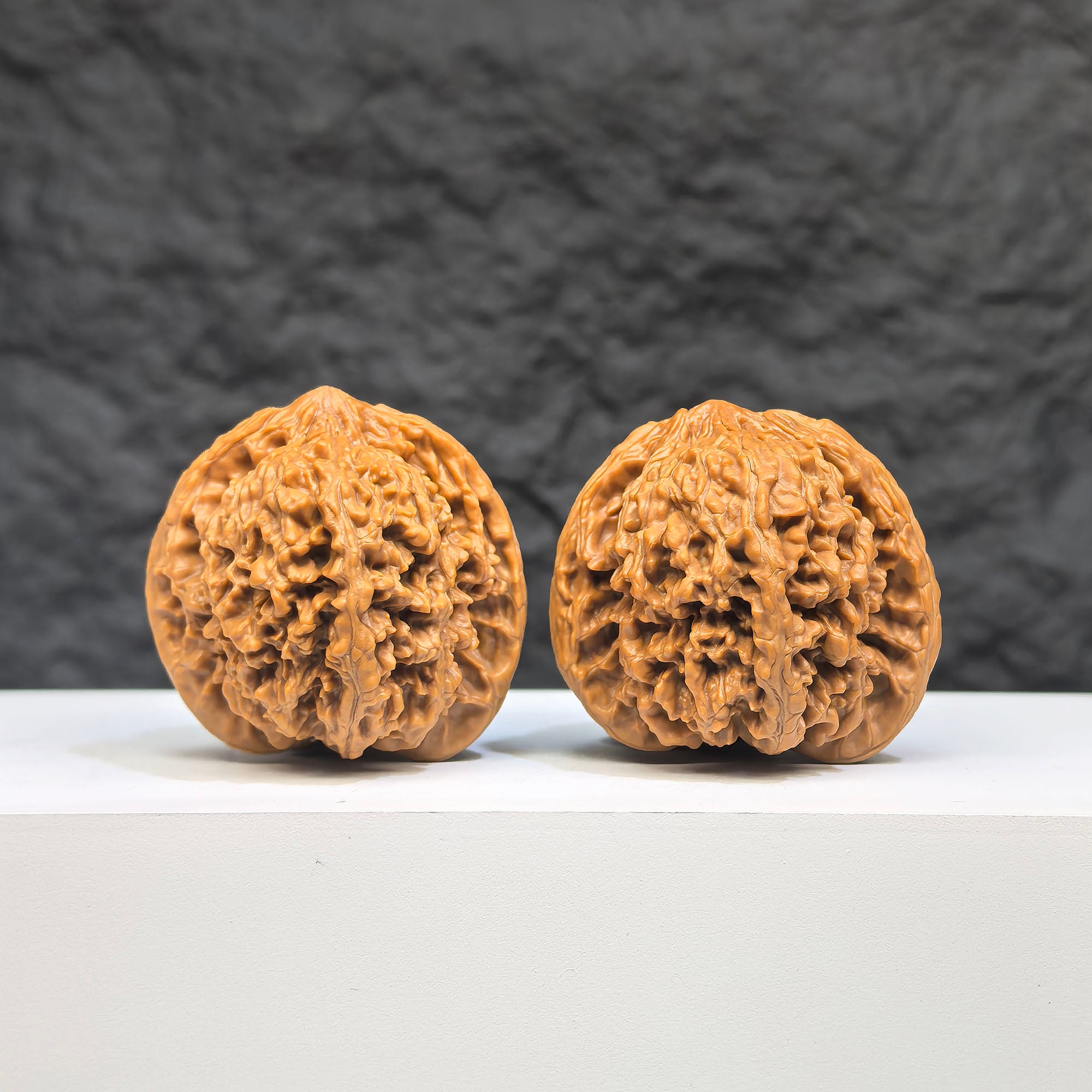 Pair of Wenwan Art Babys Breath Full Stars Wenwan walnuts with intricate star patterns, 38mm x 37mm, showcasing detailed craftsmanship.