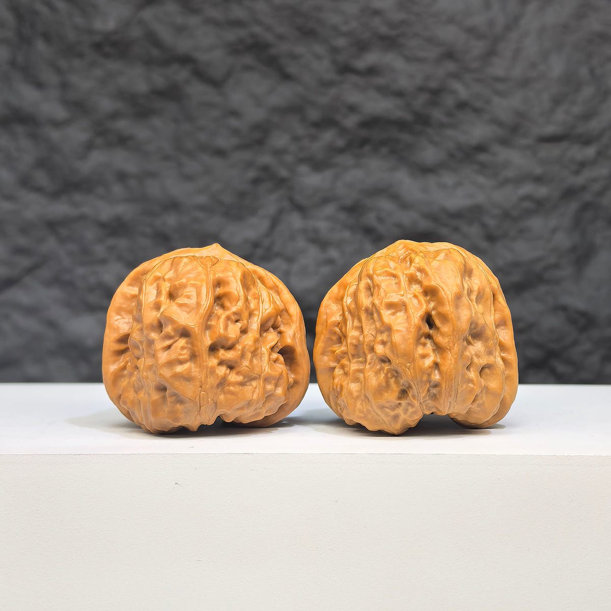 Pair of Toad Crystal Frog Wenwan Walnut carvings from Wenwan Art, featuring detailed green crystal frogs measuring 32x34mm.