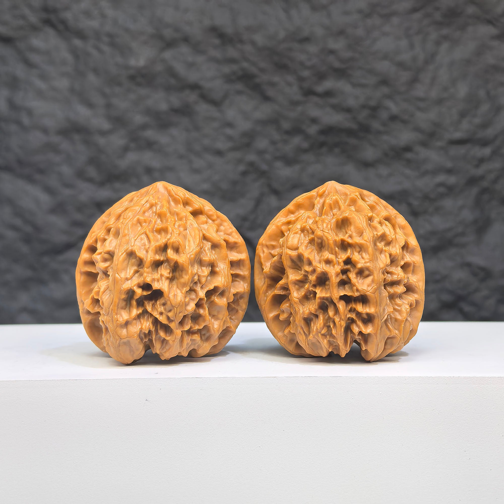 Selected grade Wild Bison Walnut from Wenwan Art, measuring 3.8×3.7cm, featuring smooth, polished surface and natural wood grain detail.