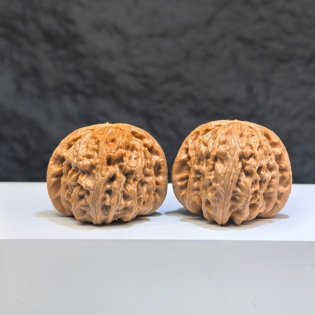 Pair of spherical white lion Wenwan walnuts from Wenwan Art, 38mm round-profile, featuring detailed lion carvings.