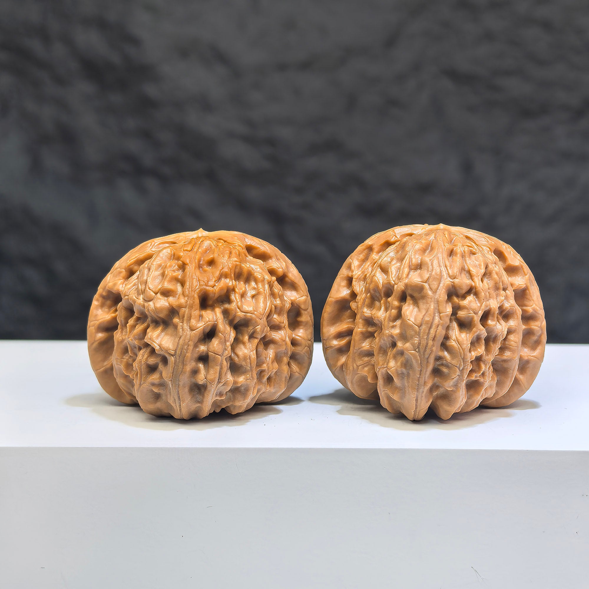 Pair of spherical white lion Wenwan walnuts from Wenwan Art, 38mm round-profile, featuring detailed lion carvings.